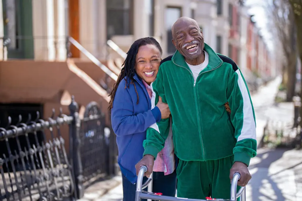 Caregiver and client walking outdoors