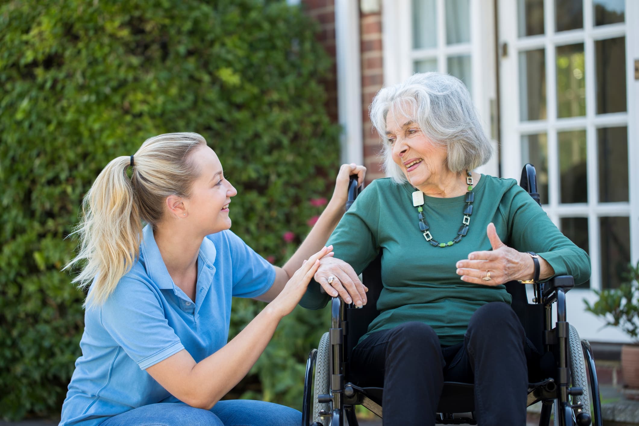 Caregiver with client in wheelchair