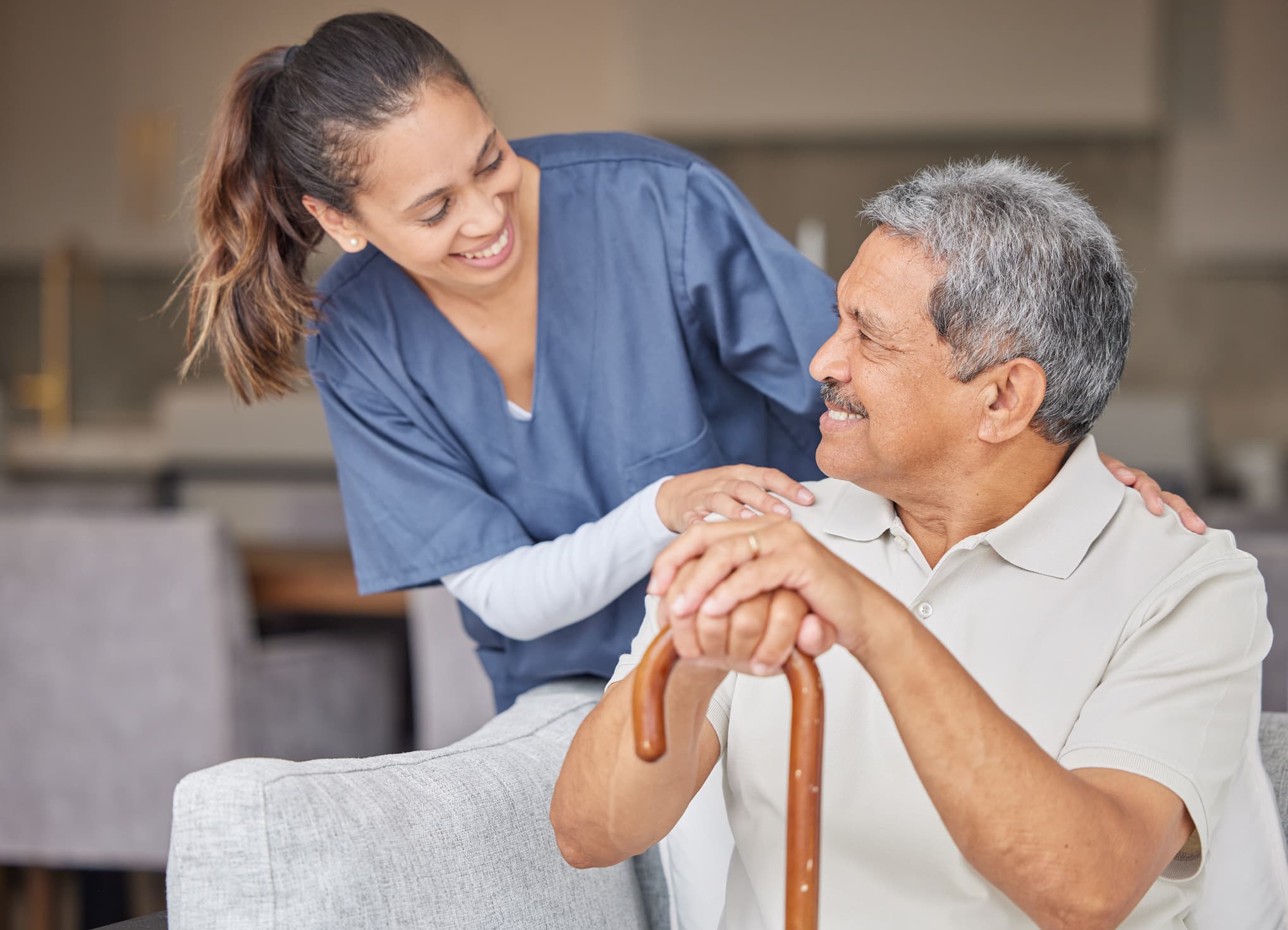 Caregiver supporting client indoors